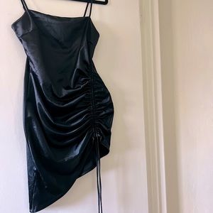 Mini dress with drawstring slit.